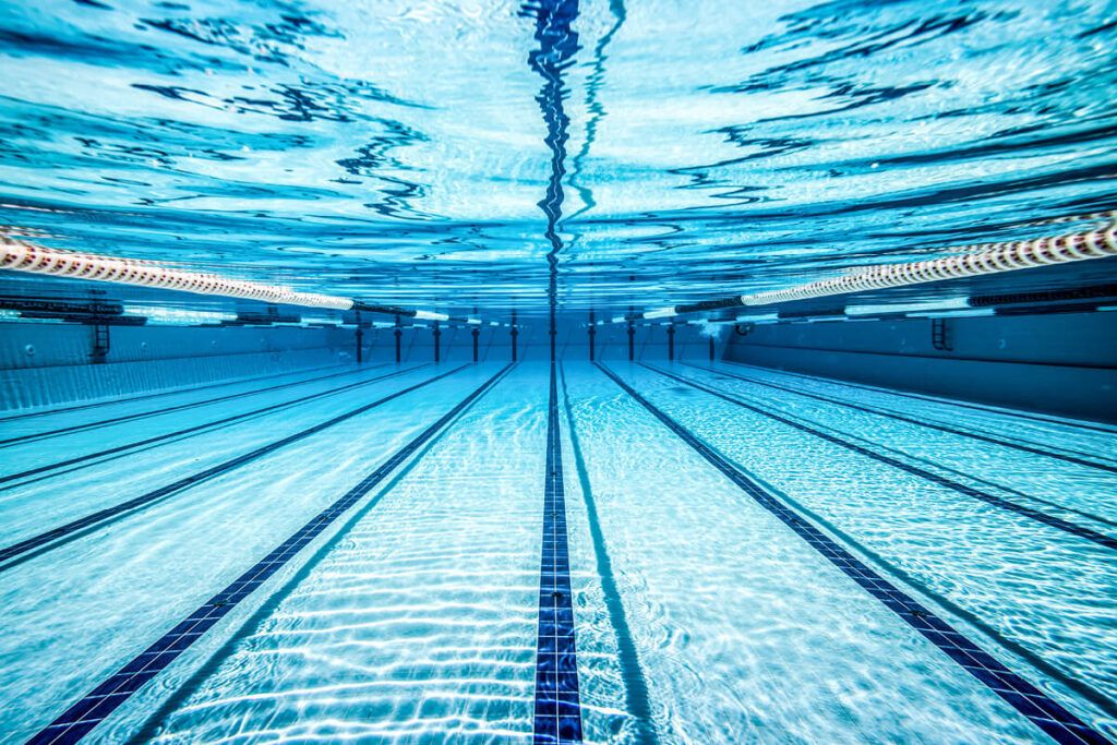 an underwater view looking down the length of a swimming pool