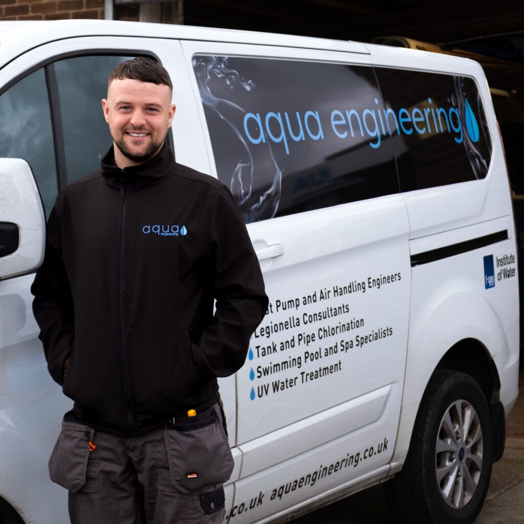 Christian McKenna, swimming pool and water treatment engineer at Aqua Engineering, pictured here beside his company van.