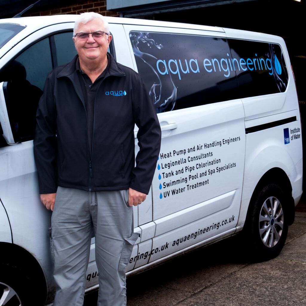 Dave Ash, a legionella assessor at Aqua Engineering. Seen here stood next to his van.