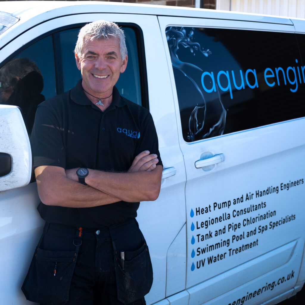 Swimming pool plant tecnician at Aqua Engineering, pictured here stood by his company van.