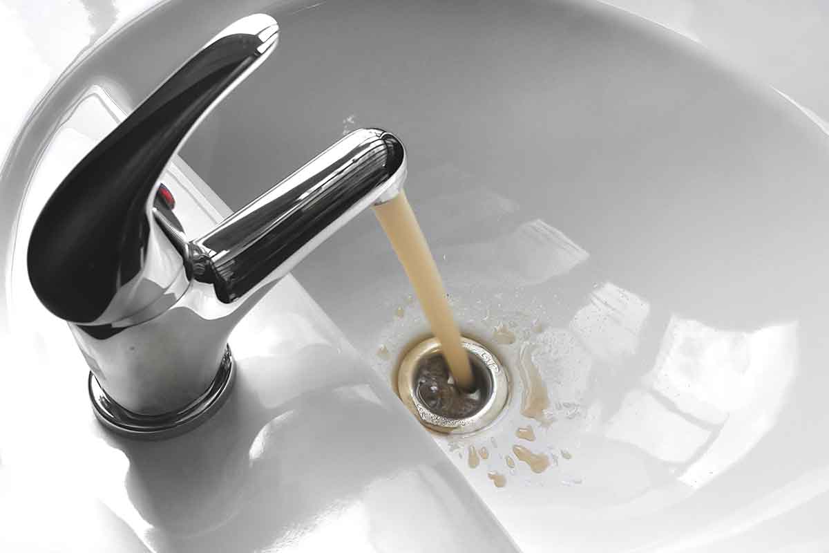 water tap with dirty running water