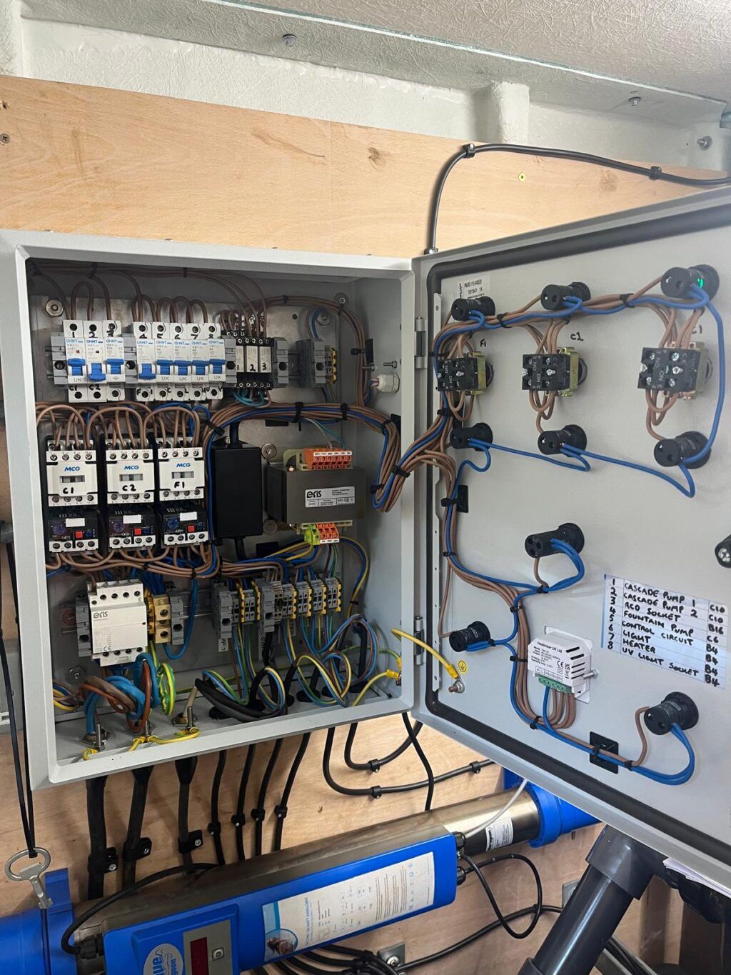 Electrical control panel with visible wires and circuits